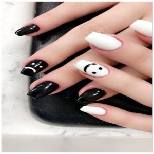 White Smiley Face and Black Sad Face Nails