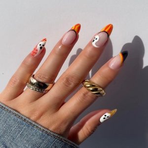​​How to create a simple black and orange Halloween nail design?